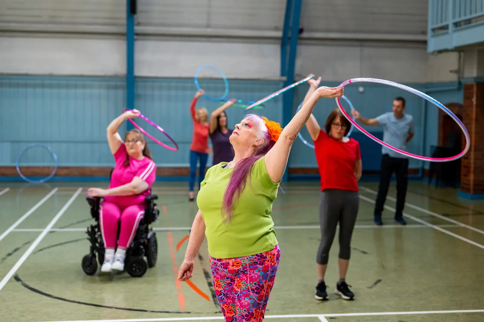 Adults taking part in an indoor group activity